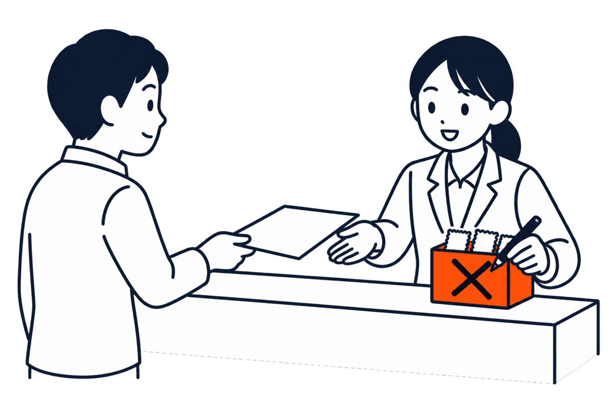 登記所の窓口で係員が収入印紙の箱に大きなバツを描いている